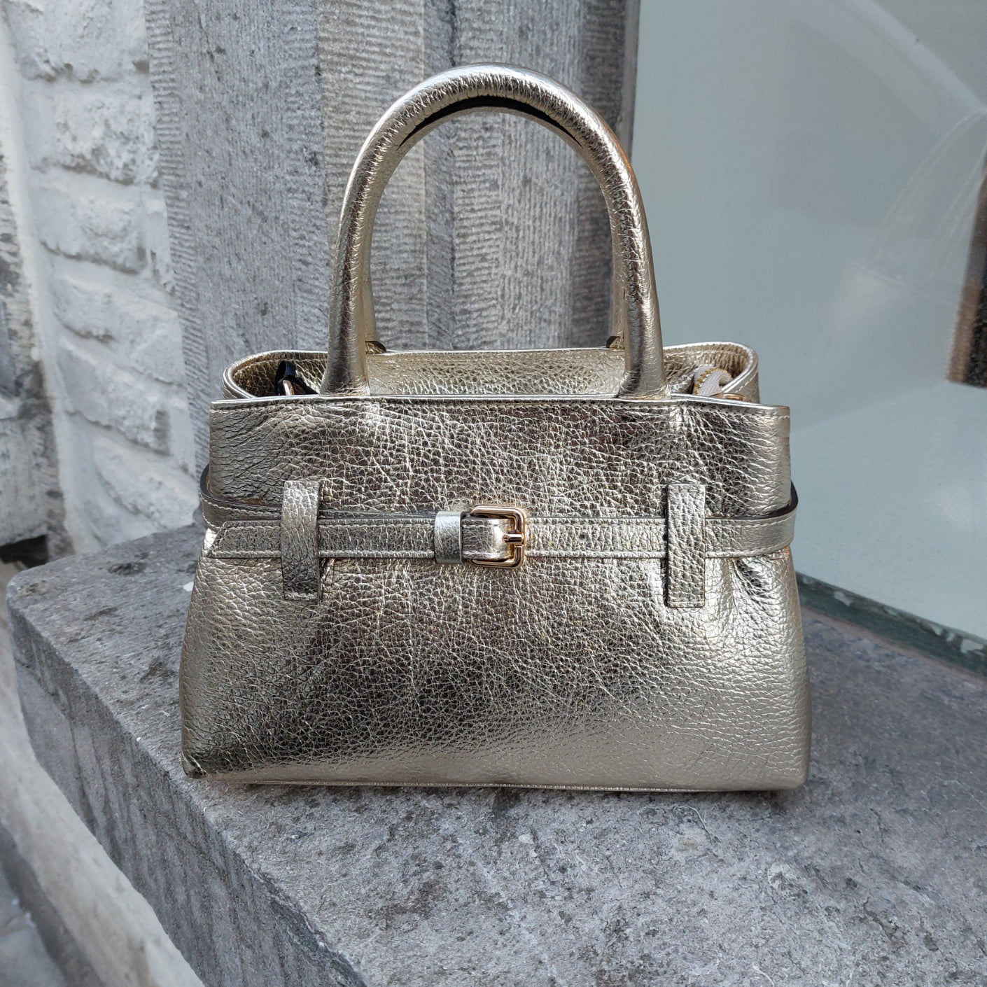 Handtasje leder goud